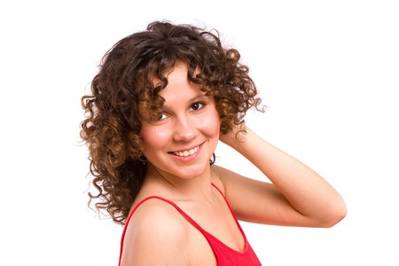 Portrait of beautiful young woman. Beautiful curly brunette is looking into the camera.の写真素材