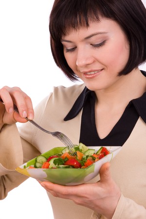 Adult woman holding plate with healthy salad. Portrait of young happy female eating saladの写真素材