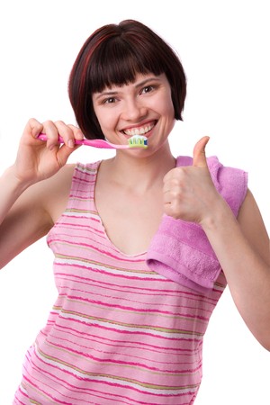 Woman cleaning her teeth.の写真素材