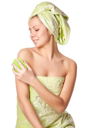 Woman in a towel does massage brushの写真素材
