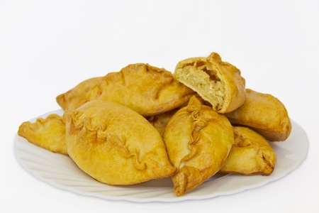 Appetizing pies on a plate on a white backgroundの写真素材