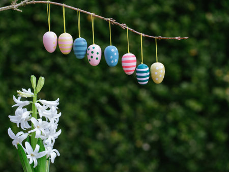 Easter eggs border on natural green background with hiacintus