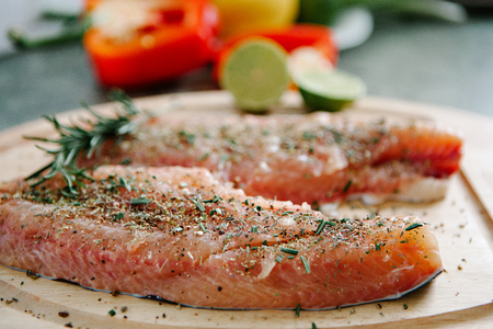 Catfish Fillets with Olive Oil, Garlic and Rosemary, Ready for Bakingの写真素材