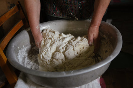 Making dough by female hands at home