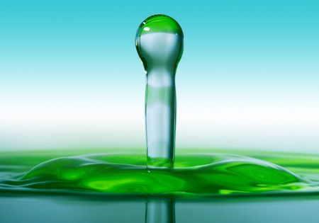 Falling Drop Splashing Into Waterの写真素材