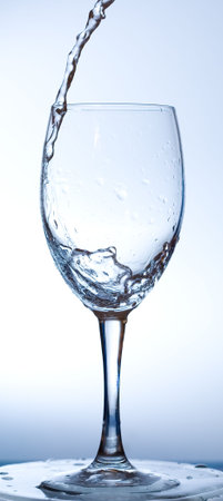 Water being poured into a wine glass