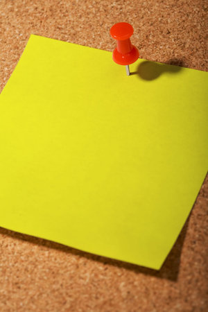 cork borad, yellow postit, tack