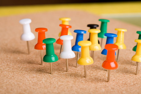color pins on the cork background