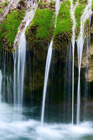 The beautiful waterfall in forest, spring,  long exposureの写真素材