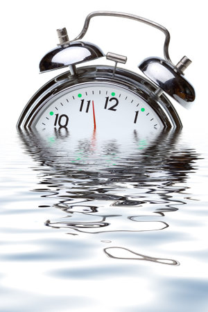 close-up view of the oldfashioned alarm clock in water