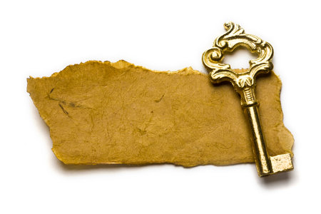 Close up view of the old key on old paperの写真素材