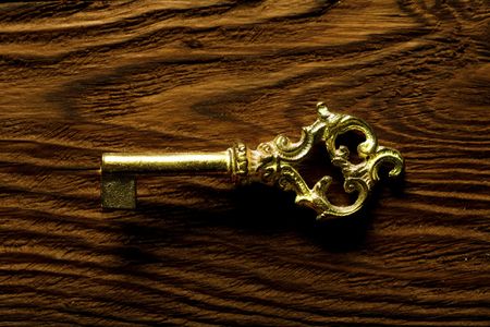 The Old key on the old wood boardの写真素材
