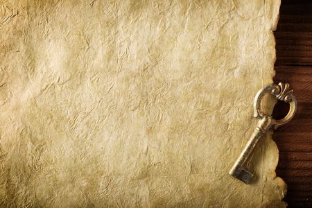 old paper and key on brown wood texture with natural patternsの写真素材