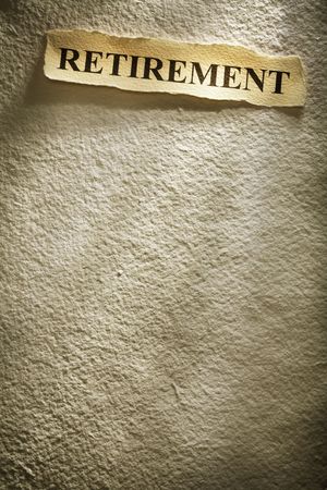 headline retirement on the old paper backgrouneの写真素材