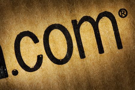 Close up view of the title ".com" on the cardboard boxの写真素材