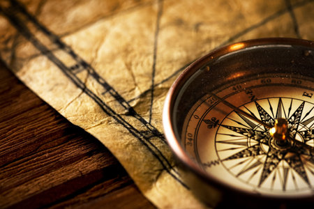 Close up view of the Compass on the old paper background