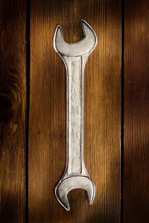 Close up view of spanner on wood board