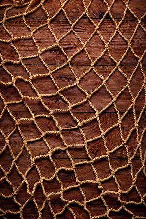 retro frame on old rope and fishing net and wood board