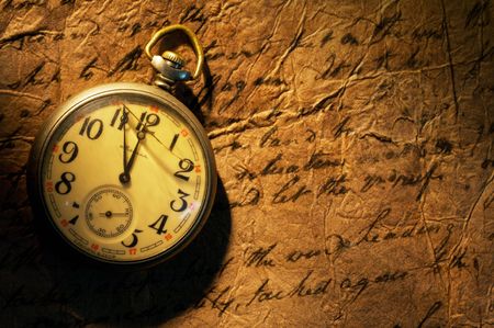 Close up view of the Pocket clock on old paperの写真素材