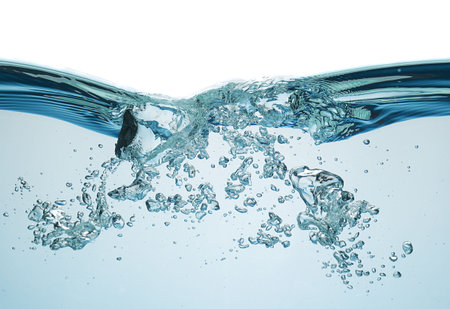 Blue water splashing on a backdrop.
