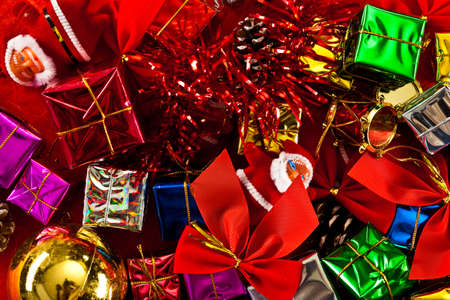 Red, Green, Gold, and Silver Wrapped Holiday Christmas Gifts on paperの写真素材