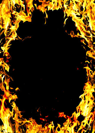 The close-up of yellow fire and dark as a backgrounの写真素材