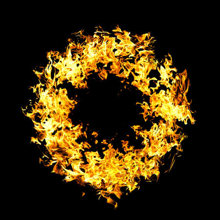 The close-up of yellow fire and dark as a backgrounの写真素材