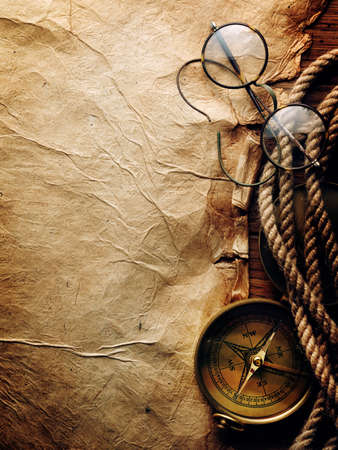 Compass, rope and glasses on old paperの写真素材