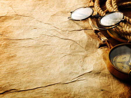 Compass, rope and glasses on old paperの写真素材