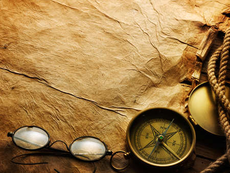 Compass, rope and glasses on old paperの写真素材