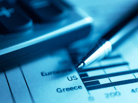 Financial concept. Calculator and pen.  shallow DOF.の写真素材