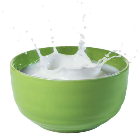 close up with a milk splash in plateの写真素材