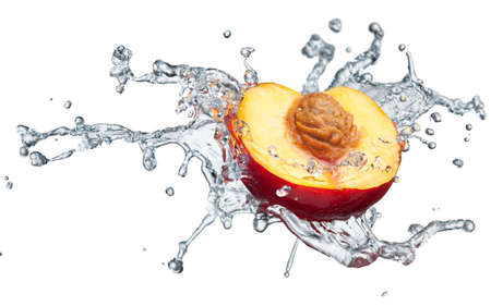 Peach in spray of water. Juicy peach with splash on white backgroundの写真素材