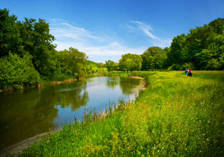 summer landscape with river and blue sky の写真素材
