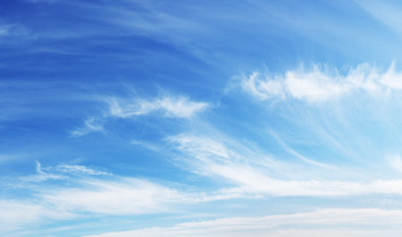 The blue sky and beautiful white clouds.