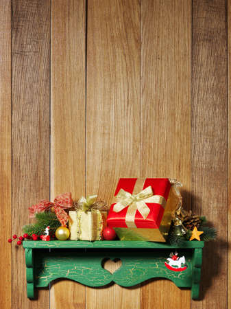 Christmas decoration with presents on wood boardの写真素材
