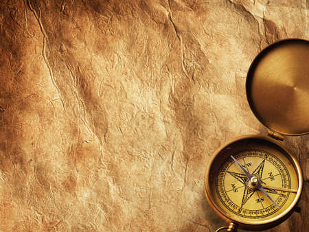 Close up view of compass on vintage paperの写真素材