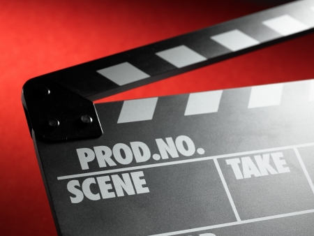 Clapper board on red backgroundの写真素材