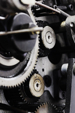 A background of a detailed view of gears from a machine.