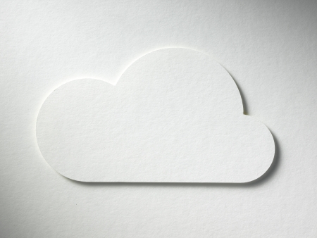 cloud cutted from paper lies on the paper backgroundの写真素材