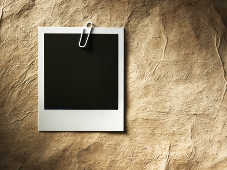 polaroid style photo frames on cardboardの写真素材