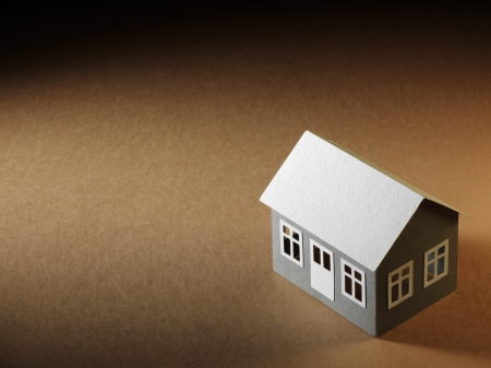 paper house on the cardboard surfaceの写真素材