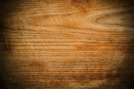Wood panel or veneer background texture with decorative woodgrain and vignetting, a natuiral...