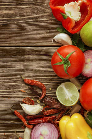 Fresh and juicy vegetables on wooden tableの写真素材