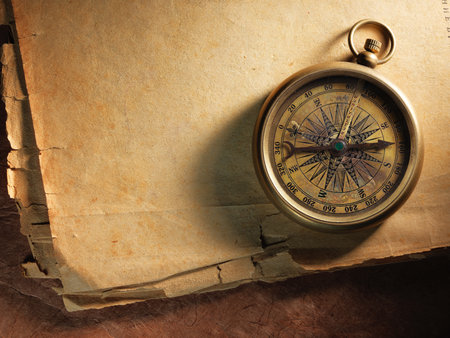 Vintage compass on the very old paperの写真素材