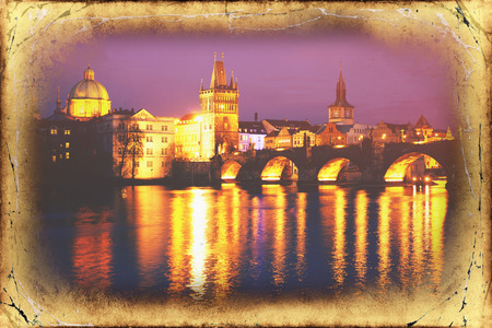View of the Lesser Bridge Tower of Charles Bridge in Prague Karluv Most the Czech Republic. This bridge is the oldest in the city and a very popular tourist attraction.Filtered image: vintage effect.のeditorial素材