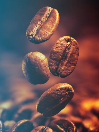 Closeup of coffee beans with focus on one.Filtered image: cool cross processed vintage effect.の写真素材