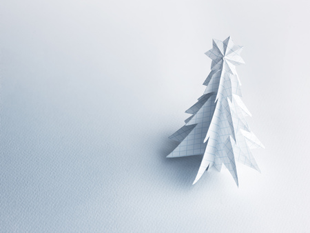 Christmas trees made of paper on white background. Christmas card.の写真素材