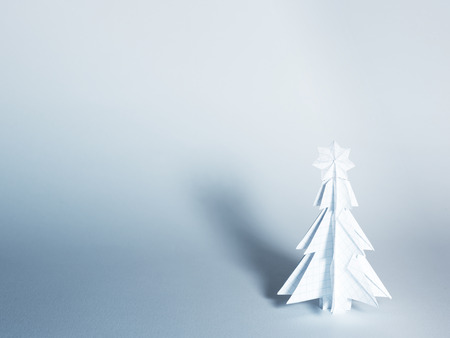 Christmas trees made of paper on white background. Christmas card.の写真素材