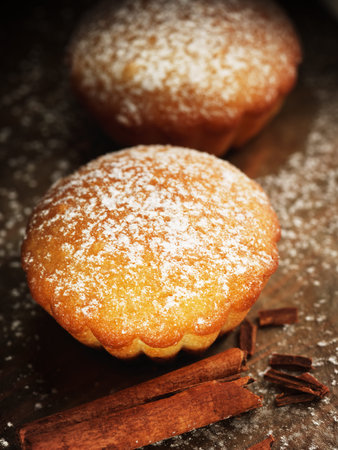 Christmas muffins covered powdered sugar, background for congratulations
